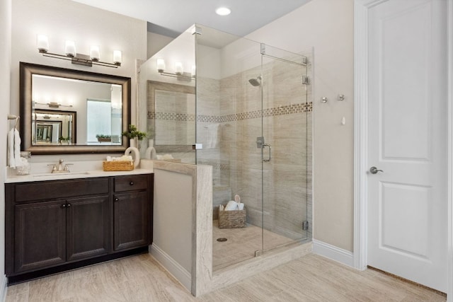 609 Glacial Stream Ln, Cedar Park, TX 78613 - full bathroom with a stall shower, vanity, baseboards, and recessed lighting
