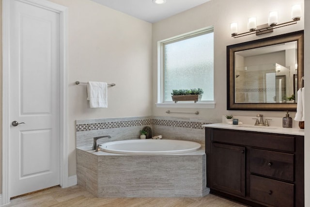 609 Glacial Stream Ln, Cedar Park, TX 78613 - bathroom featuring vanity and a garden tub