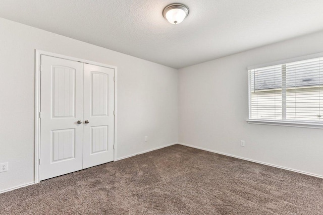 133 Nathaniel Dr, Taylor, TX 76574 - unfurnished bedroom featuring carpet and a closet