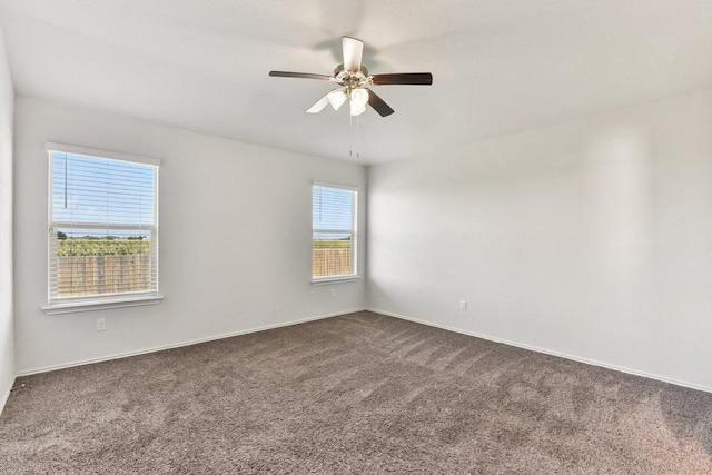 133 Nathaniel Dr, Taylor, TX 76574 - spare room featuring dark colored carpet and a ceiling fan