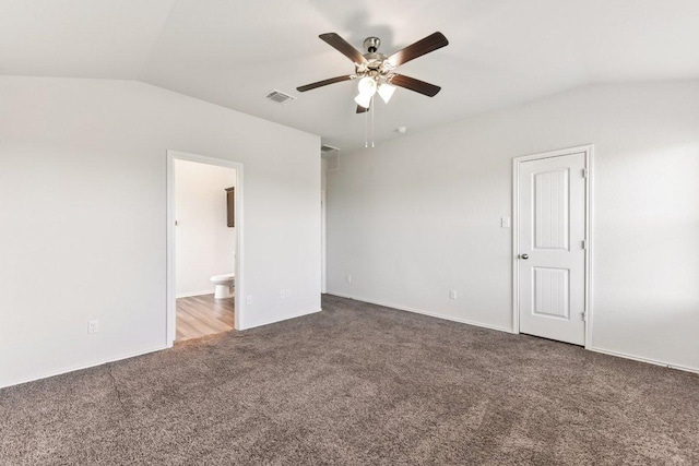 133 Nathaniel Dr, Taylor, TX 76574 - unfurnished bedroom featuring vaulted ceiling, carpet, ensuite bath, and a ceiling fan