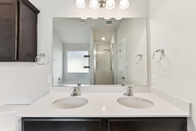 133 Nathaniel Dr, Taylor, TX 76574 - bathroom with a shower stall, double vanity, and a bath