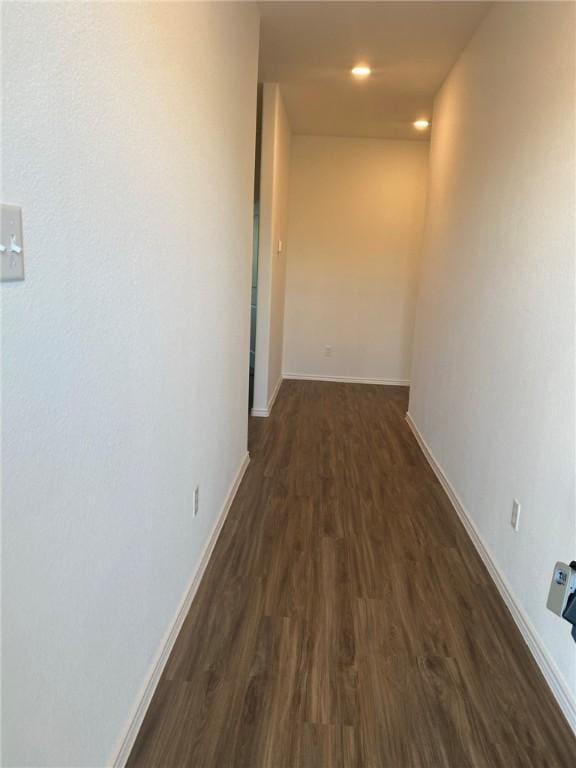 105 Akela Way, Georgetown, TX 78626 - hallway with dark wood finished floors, baseboards, and recessed lighting
