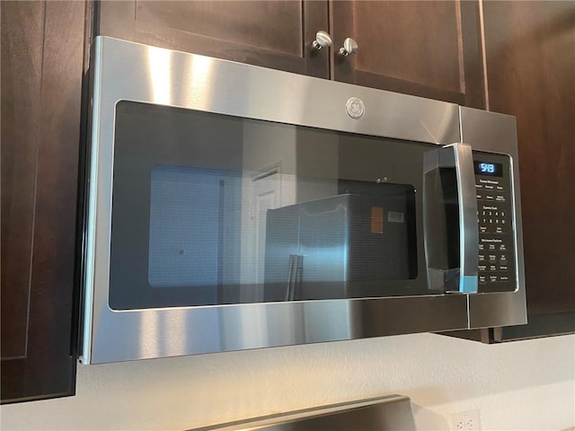 105 Akela Way, Georgetown, TX 78626 - kitchen view of stainless steel microwave and dark brown cabinets