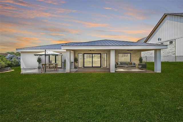 201 Custers Last Stand, Horseshoe Bay, TX 78657 - rear view of house with an outdoor living space, a ceiling fan, a patio, and a lawn
