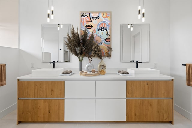 201 Custers Last Stand, Horseshoe Bay, TX 78657 - bathroom featuring double vanity, baseboards, and tile patterned flooring