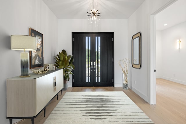 201 Custers Last Stand, Horseshoe Bay, TX 78657 - foyer featuring light wood-style floors, a chandelier, baseboards, and recessed lighting