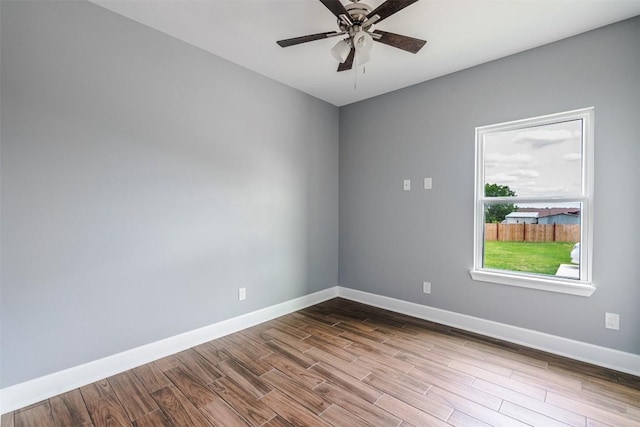 367 Stockade Ranch Rd, Paige, TX 78659 - spare room with baseboards, dark wood-type flooring, and a ceiling fan