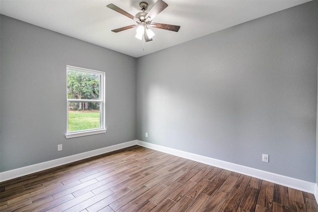 367 Stockade Ranch Rd, Paige, TX 78659 - unfurnished room with dark wood finished floors, baseboards, and ceiling fan
