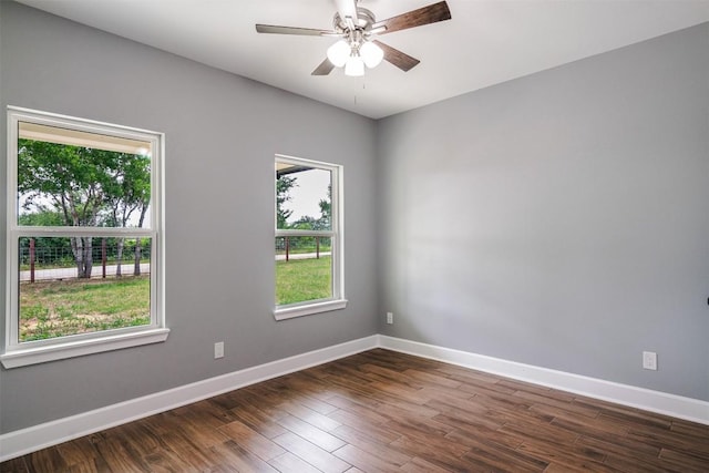 367 Stockade Ranch Rd, Paige, TX 78659 - spare room with a ceiling fan, baseboards, and dark wood-style flooring