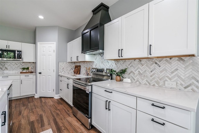 367 Stockade Ranch Rd, Paige, TX 78659 - kitchen featuring stainless steel appliances, backsplash, light stone countertops, white cabinets, and recessed lighting