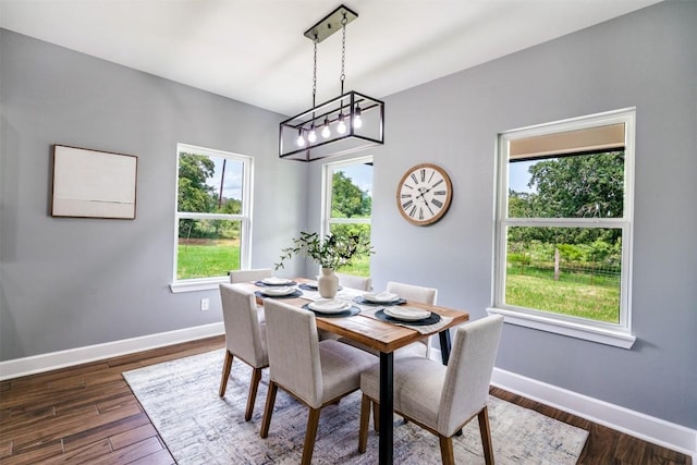 367 Stockade Ranch Rd, Paige, TX 78659 - dining area with baseboards and dark wood-type flooring
