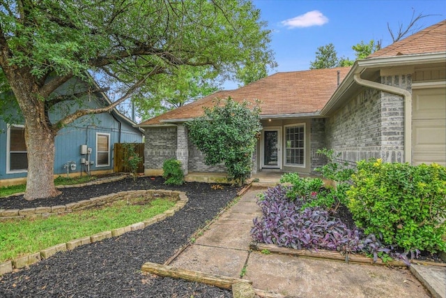 501 Maple Run, Round Rock, TX 78664 - property entrance with brick siding and a shingled roof