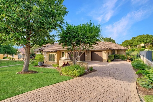 104 Porto Cima Ct, Austin, TX 78738 - view of front of house featuring decorative driveway, a garage, a tiled roof, and stucco siding