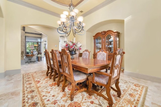 104 Porto Cima Ct, Austin, TX 78738 - dining space featuring arched walkways, crown molding, a chandelier, and a raised ceiling