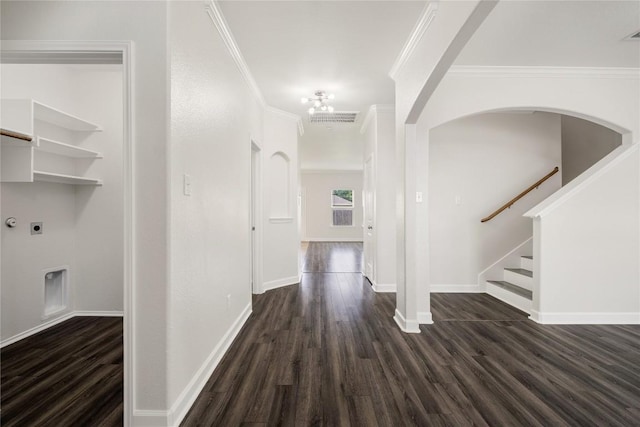 111 Colthorpe Ln, Hutto, TX 78634 - corridor with dark wood-type flooring, crown molding, baseboards, stairway, and arched walkways