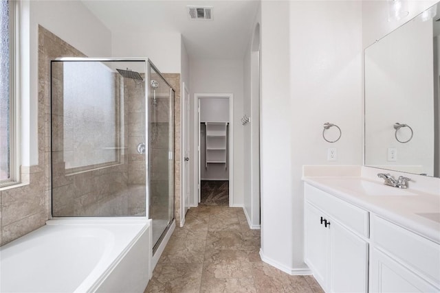 111 Colthorpe Ln, Hutto, TX 78634 - bathroom featuring a shower stall, vanity, a bath, and baseboards