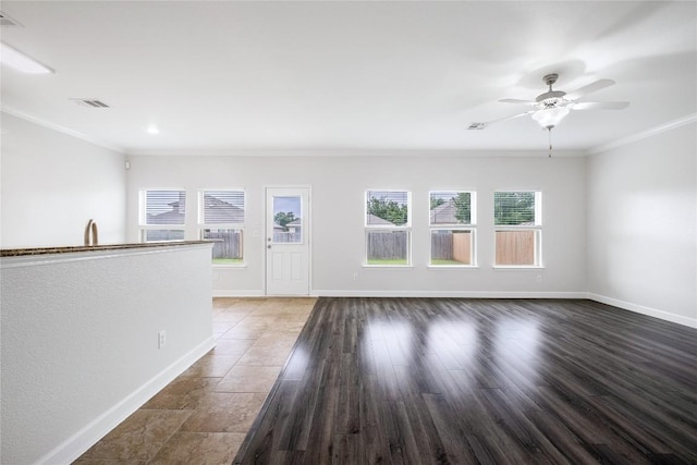 111 Colthorpe Ln, Hutto, TX 78634 - empty room featuring crown molding, a ceiling fan, and baseboards
