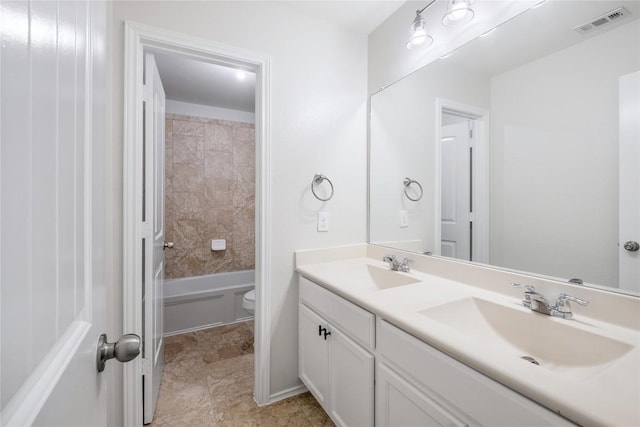 111 Colthorpe Ln, Hutto, TX 78634 - bathroom featuring double vanity, toilet, and shower / washtub combination