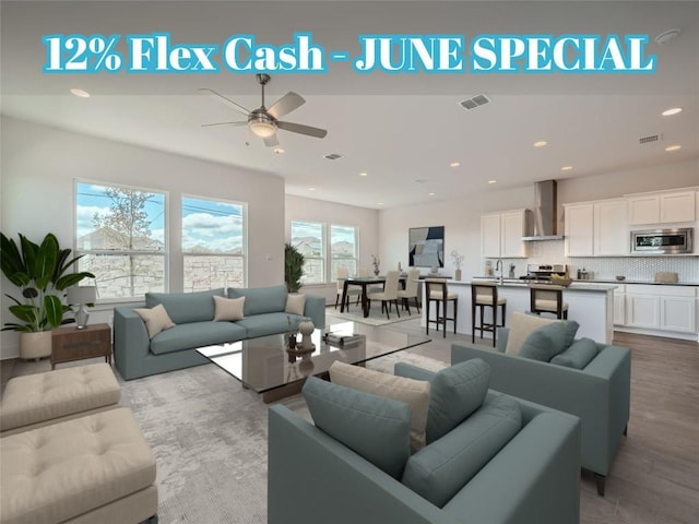 1531 N Red Bud Ln Unit 29, Round Rock, TX 78665 - living area featuring a ceiling fan, recessed lighting, and wood finished floors