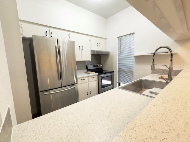 5504 Montview St, Austin, TX 78756 - kitchen featuring appliances with stainless steel finishes, backsplash, white cabinetry, and under cabinet range hood