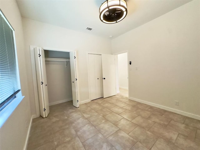 5504 Montview St, Austin, TX 78756 - unfurnished bedroom featuring two closets and baseboards