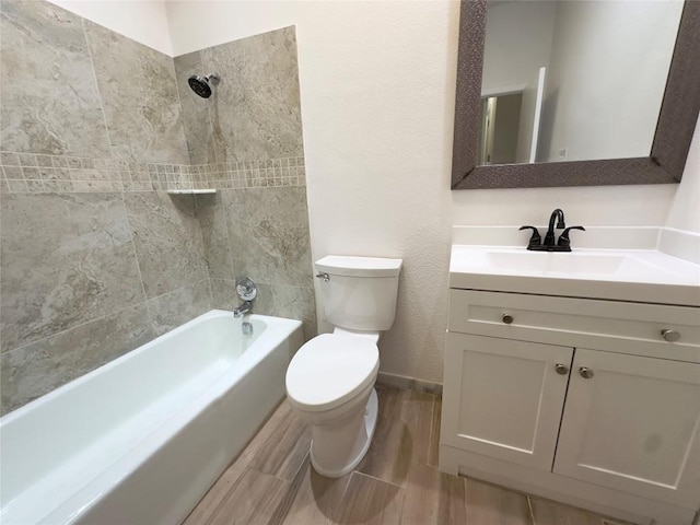 5504 Montview St, Austin, TX 78756 - full bath featuring vanity, bathtub / shower combination, wood finished floors, and a textured wall
