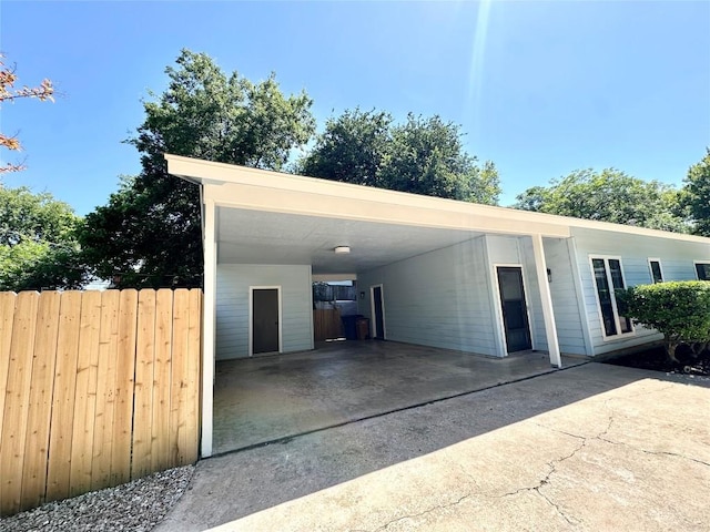 5504 Montview St, Austin, TX 78756 - garage with concrete driveway and an attached carport
