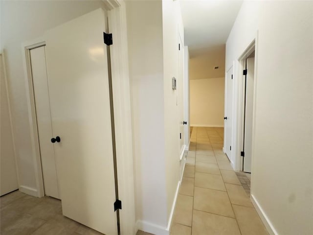 5504 Montview St, Austin, TX 78756 - hallway featuring light tile patterned floors and baseboards