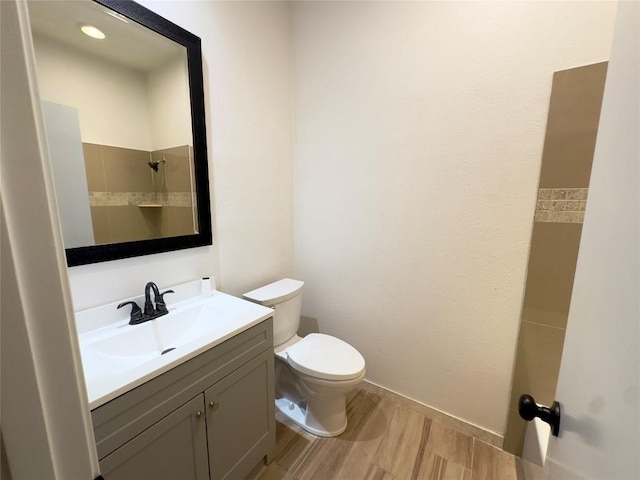 5504 Montview St, Austin, TX 78756 - full bathroom with vanity, wood finished floors, and a shower