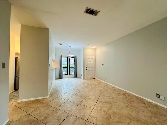 5504 Montview St, Austin, TX 78756 - unfurnished room with a chandelier and light tile patterned flooring