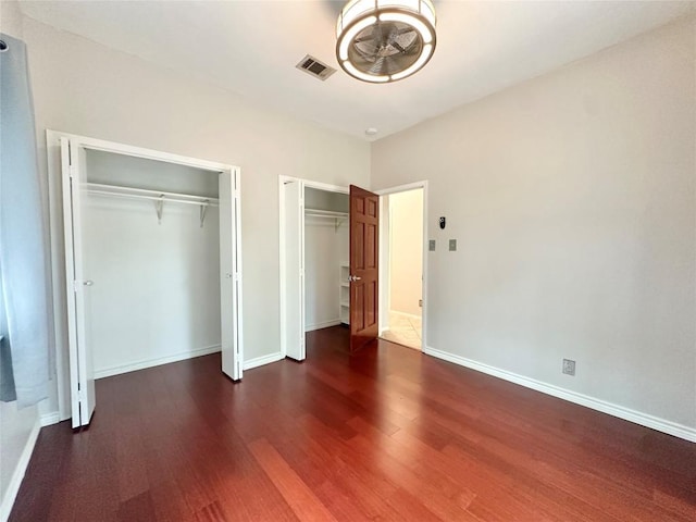 5504 Montview St, Austin, TX 78756 - unfurnished bedroom with two closets and wood finished floors