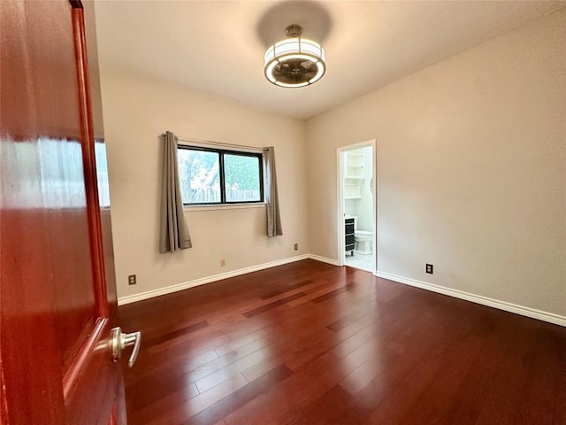 5504 Montview St, Austin, TX 78756 - empty room with dark wood-style flooring and baseboards