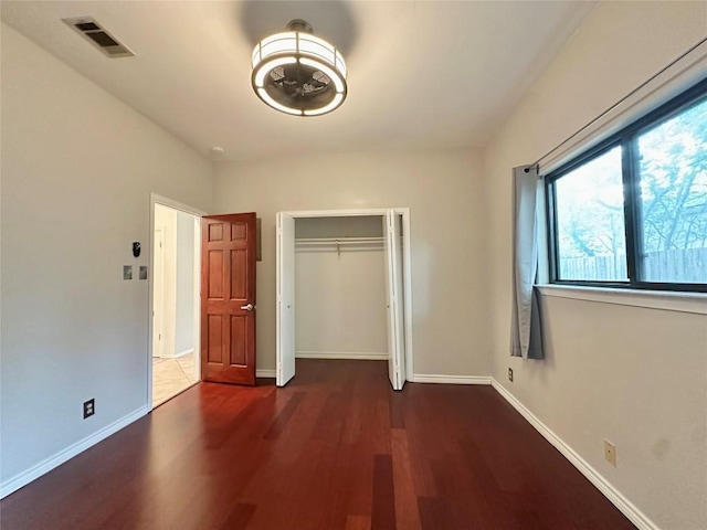 5504 Montview St, Austin, TX 78756 - unfurnished bedroom with wood finished floors and a closet