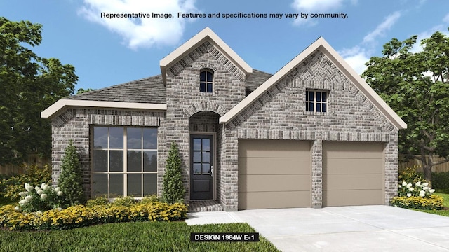 165 Plumbago Loop, Bastrop, TX 78602 - french country home with concrete driveway, stone siding, and an attached garage