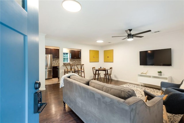 605 Orland Blvd, Austin, TX 78745 - living area with ceiling fan, dark wood-type flooring, ornamental molding, and baseboards