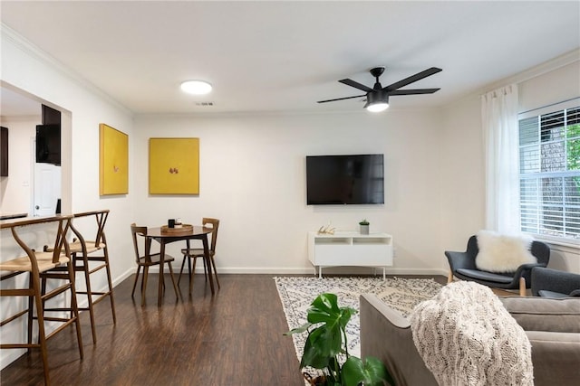 605 Orland Blvd, Austin, TX 78745 - living area featuring dark wood-type flooring, crown molding, a ceiling fan, and baseboards