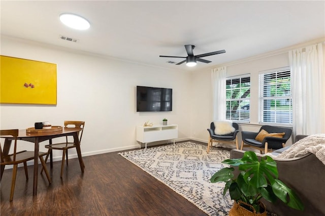 605 Orland Blvd, Austin, TX 78745 - living area with wood finished floors, ceiling fan, baseboards, and crown molding