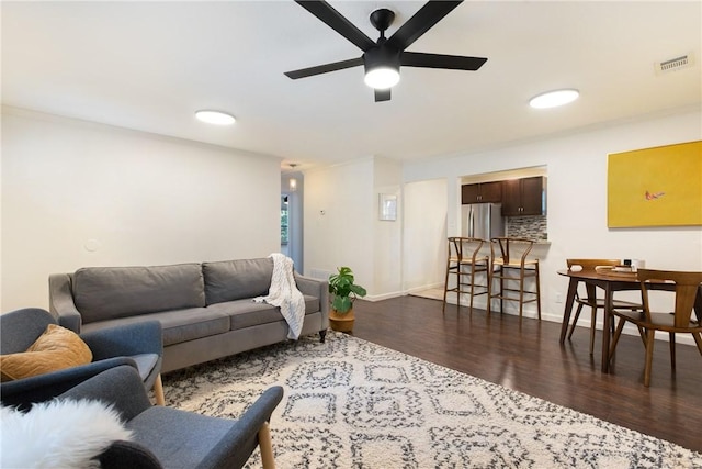605 Orland Blvd, Austin, TX 78745 - living area featuring dark wood finished floors, a ceiling fan, and baseboards