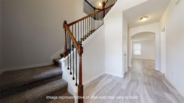 210 Dewey Dr, Killeen, TX 76542 - staircase featuring arched walkways, wood finished floors, and baseboards