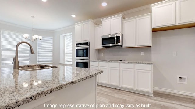 210 Dewey Dr, Killeen, TX 76542 - kitchen with appliances with stainless steel finishes, a sink, white cabinetry, light wood-style floors, and light stone countertops