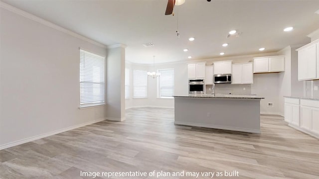 210 Dewey Dr, Killeen, TX 76542 - kitchen featuring stainless steel appliances, ornamental molding, a ceiling fan, light wood-style flooring, and white cabinetry