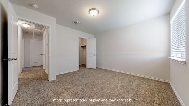 210 Dewey Dr, Killeen, TX 76542 - unfurnished bedroom featuring attic access, carpet floors, and multiple windows