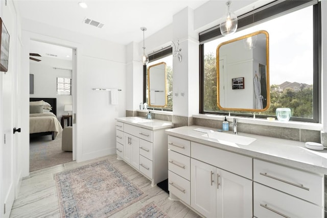 208 Honey Creek Ct Unit 29, Austin, TX 78738 - bathroom with connected bathroom, two vanities, and recessed lighting