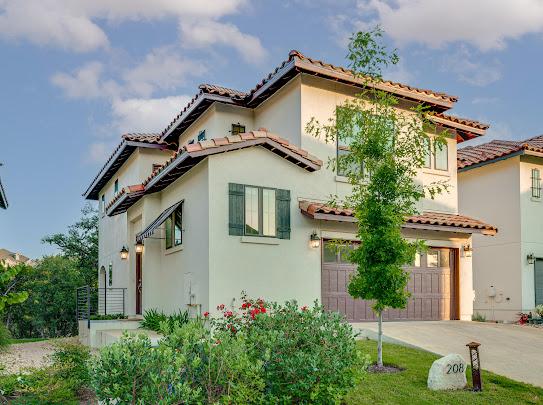 208 Honey Creek Ct Unit 29, Austin, TX 78738 - mediterranean / spanish-style house with an attached garage, a tile roof, concrete driveway, and stucco siding