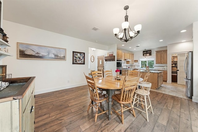 3205 River Place Dr Unit B, Belton, TX 76513 - dining area featuring light wood finished floors, a chandelier, recessed lighting, and baseboards