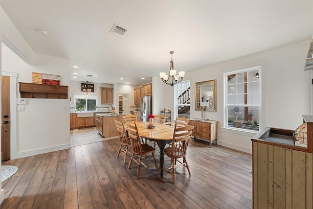 3205 River Place Dr Unit B, Belton, TX 76513 - dining space with hardwood / wood-style flooring, a chandelier, stairs, baseboards, and recessed lighting