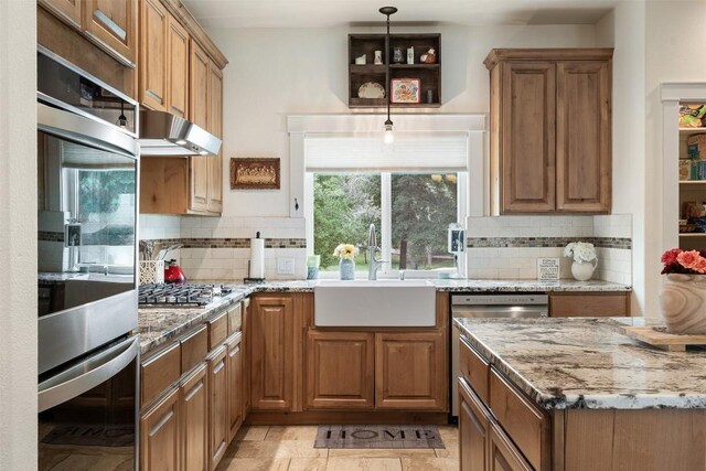3205 River Place Dr Unit B, Belton, TX 76513 - kitchen with appliances with stainless steel finishes, a sink, backsplash, and light stone countertops