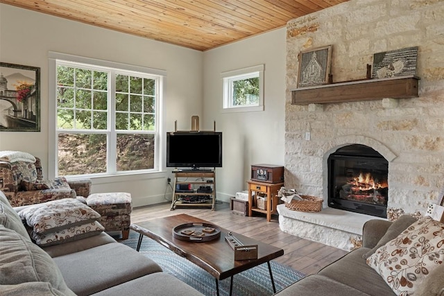 3205 River Place Dr Unit B, Belton, TX 76513 - living room with wood ceiling, a fireplace, wood finished floors, and baseboards