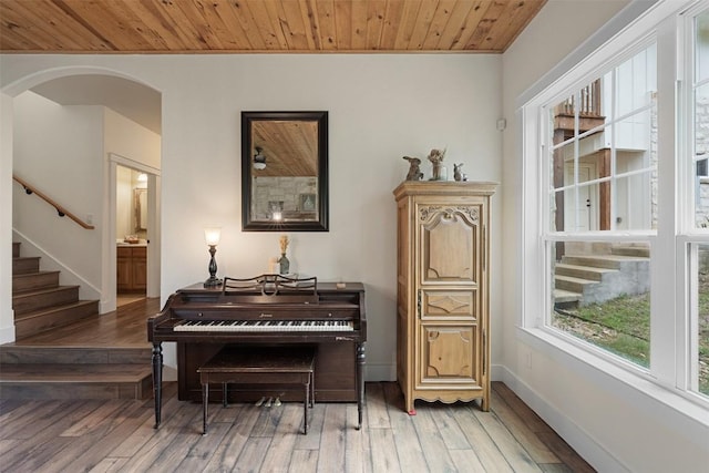3205 River Place Dr Unit B, Belton, TX 76513 - sitting room featuring wood ceiling, wood-type flooring, stairs, arched walkways, and baseboards